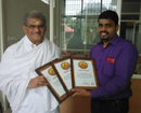 Heggade felicitates Rajesh Prabhu Pernal upon bagging Assist World Record